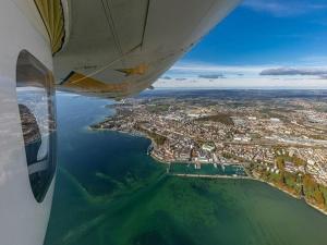 a view of a city from the wing of an airplane at Ferienhaus Jäger in Friedrichshafen