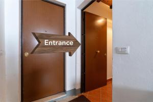 an entrance sign in front of a door at Somewhere Over the Hills in Terni +39 photos