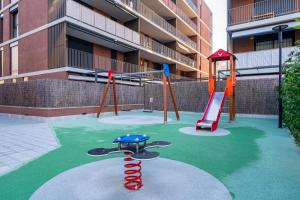 a playground with a slide at Costa Dorada Perle in Calafell