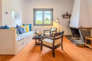a living room with a couch and a table at Mas Vinyoles 1 in Montnegre