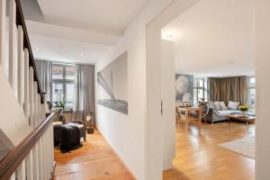 a living room with a couch and a table at Klosterperle in Neuruppin