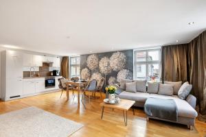 a living room with a couch and a table at Klosterperle in Neuruppin