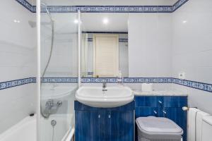 a bathroom with a sink and a toilet at Casa Deti in Roses +13 photos