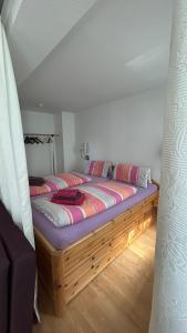 a bedroom with a wooden bed in a room at Villa Fichteneck in Oberhof