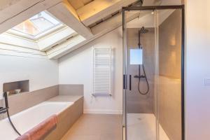 a bathroom with a shower and a bath tub at Rio Tío Cocinas in La Granja de San Ildefonso +29 photos