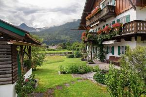 a view of a yard between two buildings at Ferienwohnung Reschbergwies'n in Farchant