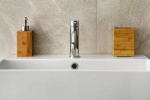 a sink with a faucet on top of it at Dolomiti e Misurina My dreams in Misurina +22 photos