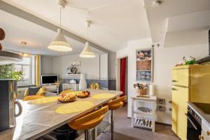 a kitchen with a table with fruits on it at Das Spatzennest in Bad Sachsa
