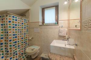 a bathroom with a sink and a toilet and a shower at Villa Marisol Agrustos in Budoni +27 photos
