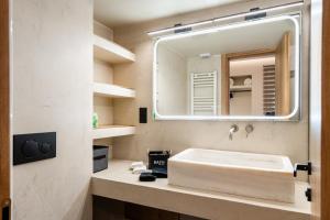 a bathroom with a sink and a mirror at The Apex Boutique Apartment B1 in Athens