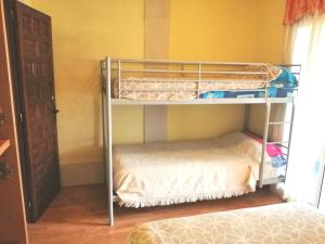 a bunk bed in a room with a bunk bedscribed at Roses in Roses