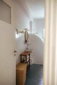 a bathroom with a sink and a mirror at Adelfia Studios in Parikia +138 photos
