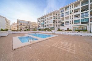 a large building with a swimming pool in front of a building at Casa Altea-mar in Altea