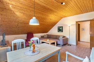 a living room with a table and a couch at Haus Berger in Seebach +22 photos