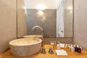 a bathroom with a large sink and a mirror at Ow Andros Suite 3,Private Whirlpool in Andros +20 photos