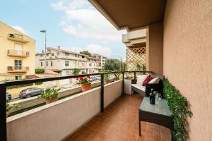 a balcony with a table and a view of a city at Sa Babbajola in Cagliari