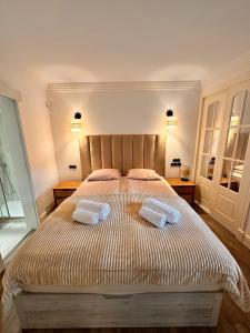 a bedroom with a bed with two towels on it at Parque Miraflores in Mijas +20 photos