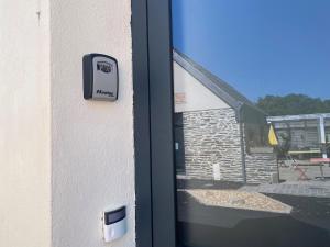 a door with a sign on the side of a building at La Factory Saint Aignan in Saint-Aignan