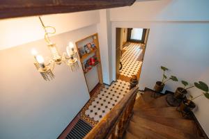 a living room with a bench and a hallway at Alte Konditorei in Lindau