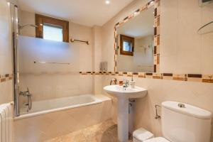 a bathroom with a sink and a toilet and a bath tub at Milano in Campo