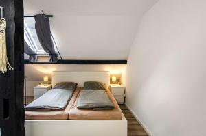 a bedroom with two beds in a room at Ferienwohnung Didi in Detern