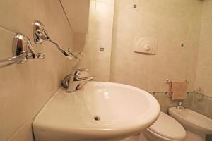 a bathroom with a sink and a toilet at Casa Vacanze Martina a Otranto in Otranto
