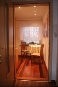 a dining room with a table and two chairs at Apartment für 2, nicht für Monteure in Niederau +10 photos