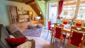 a living room with a couch and a table at Schwarzwaldferienwohnung Oberle in Todtnau