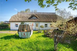 a boat in the yard of a house at Ferienhaus Struve in Trent