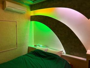 a room with a rainbow painted on the wall at 福井ホテルシルビア in Fukui