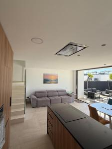 a living room with a couch and a table at Santa Rosalia Lake & Life resort in Torre-Pacheco