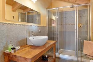 a bathroom with a sink and a shower at Chalet de La Poya in Valtournenche +54 photos