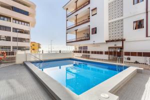 a swimming pool on the roof of a building at Martimar Candelaria in Candelaria