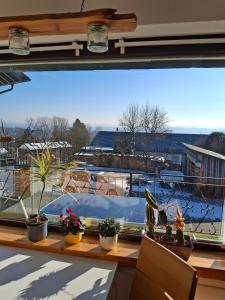 a window with a view of a boat in a harbor at Ferienhaus Höhenflug in Attendorn