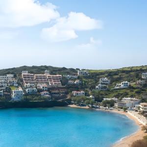 an aerial view of a beach and buildings at Batsi view house in Andros