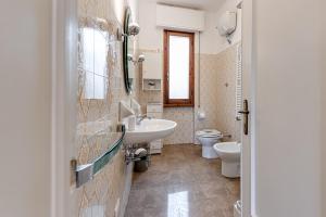 a bathroom with a sink and a toilet at Depandance Resort in Borgo San Lorenzo