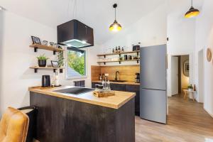 a kitchen with a counter top and a refrigerator at Ferienhaus 14 in Bad Arolsen