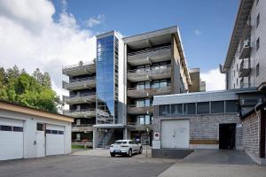 a car parked in front of an apartment building at Fewo Berggipfel am Feldberg in Feldberg