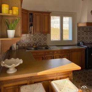 a kitchen with a sink and a counter top at Casa Nova in Porte di Rendena
