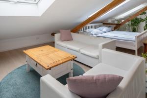 a living room with a couch and a table at Ferienhaus Engelsberghof in Endingen