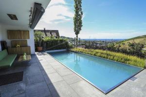 a swimming pool in the middle of a house with a view at Ferienhaus mit Panoramablick in Bühlertal +15 photos