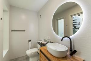 a bathroom with a sink and a mirror at Los Mojones in Artenara +17 photos