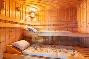a sauna with a bed in the middle of it at Ferienhaus Burghalde mit Sauna in Alpirsbach