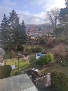 an aerial view of a backyard with a yard with a pool at Sachsen Rosie in Hartmannsdorf