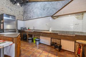 a kitchen with a counter and a sink in it at Casabras Rural in Claravalls