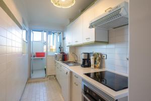 a kitchen with a sink and a counter top at Apartment with Swimming-pool in Marbella