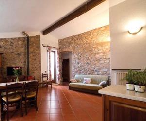 a living room with a couch and a table at Agriturismo Il Colletto in Albenga