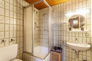 a bathroom with a shower and a sink at Haus Azalea in Olsberg +62 photos