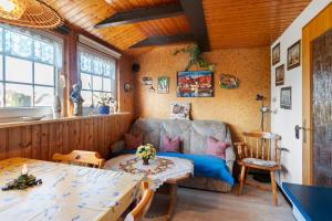 a living room with a couch and a table at Haus Sielblick in Wangerland