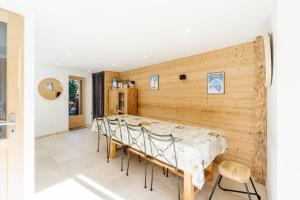 a dining room with a table and chairs at Meribel le chalet d'eugénie in Les Allues +22 photos